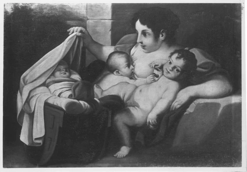 Caritas con un bambino nella culla